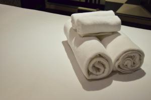 a stack of towels sitting on top of a table at Double Five in Bangkok