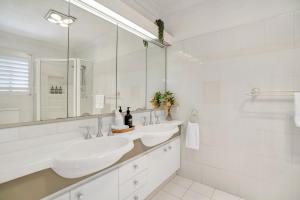 a white bathroom with two sinks and a mirror at The Avenue at Montville (House) in Montville +38 photos
