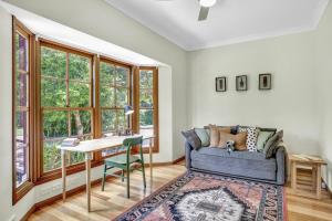 a living room with a couch and a table at The Avenue at Montville (House) in Montville