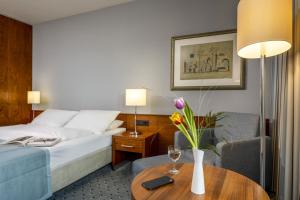 Postel nebo postele na pokoji v ubytování Maritim Hotel Darmstadt