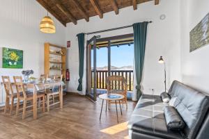 a living room with a couch and a table at Picuastur in Cangas de Onís