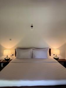 Postel nebo postele na pokoji v ubytování Maho Boutique Hotel
