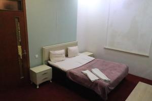 Postel nebo postele na pokoji v ubytování Ekm Hotel