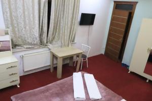 TV a/nebo společenská místnost v ubytování Ekm Hotel