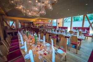 a dining room with a long table and chairs at Hotel Schindlerhof in Nürnberg