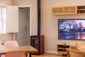 TV a/nebo společenská místnost v ubytování Casa do Solar by VinteOito