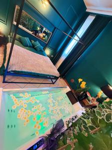 a room with two bunk beds and a aquarium at AMA Esclusive SPA Amore in Ferrara +22 photos