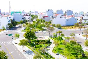 an aerial view of a city with buildings and trees at Sand Sea Hotel Phan Thiết in Phan Thiet
