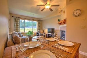 a dining room with a table with wine glasses on it at Big Sky Resort and Lone Peak Views in Big Sky