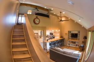 a staircase leading up to a kitchen and a living room at Sky Is The Limit Centrally Located For Big Sky Fun in Big Sky