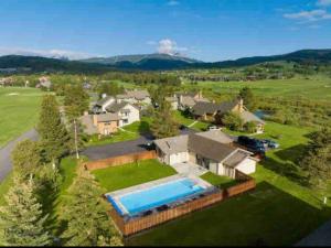 an aerial view of a house with a swimming pool at Sky Is The Limit Centrally Located For Big Sky Fun in Big Sky