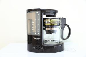 a black coffee maker with a blender on a white background at サザンコースト湘南 in Chigasaki