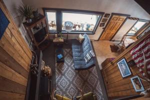 an overhead view of a living room with a blue couch at Big Sky Bungalow in Big Sky