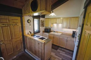 a kitchen with wooden cabinets and a counter top at Big Sky Bungalow in Big Sky