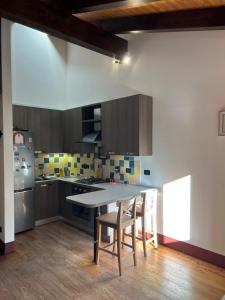 a kitchen with a table and chairs in it at Agriturismo Rio Verde in Sasso Marconi