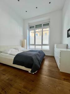 Łóżko lub łóżka w pokoju w obiekcie REMA Apartments 1080