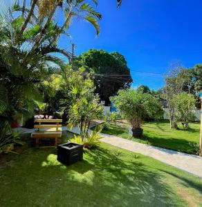 a park with a picnic table and a bench at Pousada e Hostel Recanto das Estrelas in Marau