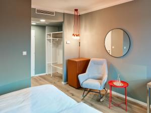 سرير أو أسرّة في غرفة في Hotel Weitzer Graz - Centre of Graz