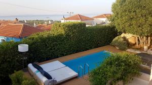 The swimming pool at or close to FEEL LIKE HOME IN LESVOS