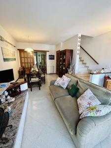 a living room with a couch and a table at Villetta Alberto in Viareggio