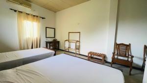 Rúm í herbergi á Jungle Edge Home Sigiriya