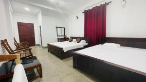 Rúm í herbergi á Jungle Edge Home Sigiriya