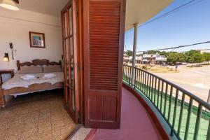 En eller flere senge i et værelse på Hotel Atero