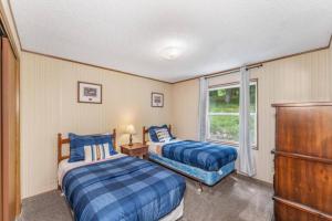 a bedroom with two beds and a window at TB-15 Thunder Bay Resort Cabin15 in Phelps