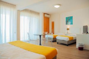 Postel nebo postele na pokoji v ubytování Hotel Bel 3
