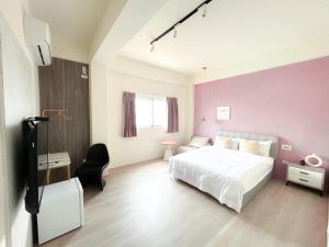 Een bed of bedden in een kamer bij 沙沙民宿