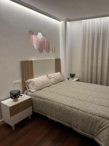 Ένα ή περισσότερα κρεβάτια σε δωμάτιο στο Apartamento turistico plaza del ayuntamiento