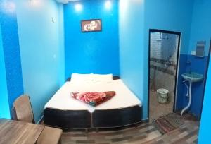 Postel nebo postele na pokoji v ubytování RELAX PAYING GUEST HOUSE