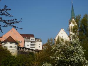 a city with a church and a building with a steeple at Bed & Breakfast Engen in Engen