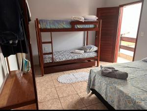 Postel nebo postele na pokoji v ubytování Aconchego by the lagoon