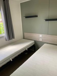 Postel nebo postele na pokoji v ubytování mobil home 742