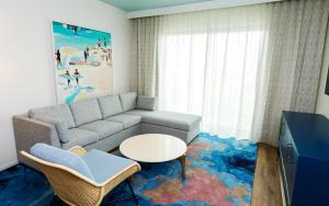 a living room with a couch and a table at Holiday Inn Club Vacations Myrtle Beach Oceanfront in Myrtle Beach