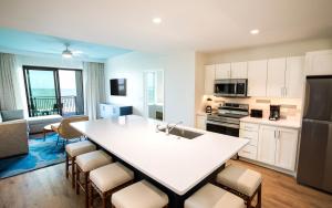 a kitchen with a large white island in a room at Holiday Inn Club Vacations Myrtle Beach Oceanfront in Myrtle Beach