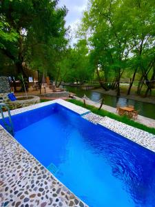 Bazén v ubytování Gizli Cennet Villages Hotel nebo v jeho okolí