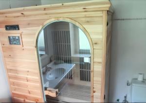 a bathroom with a mirror and a sink at Maison spacieuse avec sauna à Héricy de 230 m² in Héricy