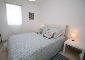 Postel nebo postele na pokoji v ubytování Appartement vue mer et montagnes