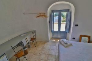 Voodi või voodid majutusasutuse Masseria Trullo Sovrano Exclusive B&B toas