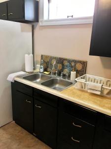 a kitchen with a sink and a counter at Historic Upstairs Apartment in Bellevue