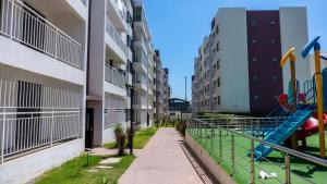 a playground in the courtyard of an apartment building at Pristine Homes Studio Apartment - Mombasa Road in Nairobi