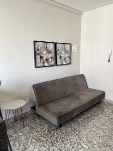 a couch in a room with a table and a table at LK Lourdes 12 in Belo Horizonte