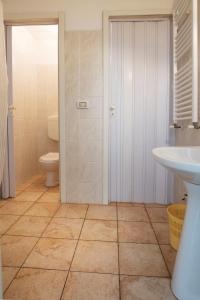 a bathroom with a toilet and a sink at Autentico Agri Salento in Morciano di Leuca