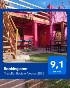 a review of a house with a pink house at Hostel Ruta76 in Sierra de la Ventana