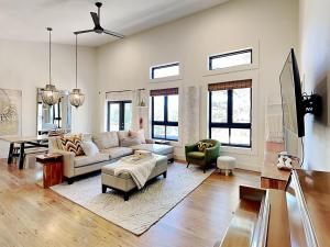 a living room with a couch and a table at Casa Blanca in Ruidoso +24 photos