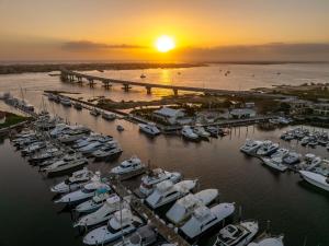 a group of boats docked in a marina at sunset at Inn at Camachee Harbor in Saint Augustine