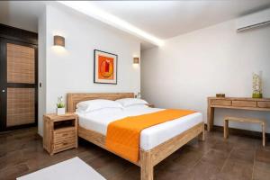 a bedroom with a large bed and a desk at Villa with pool in Ramena, sea view in Ramena +6 photos