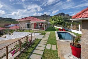 a house with a yard with a swimming pool at Villa with pool in Ramena, sea view in Ramena